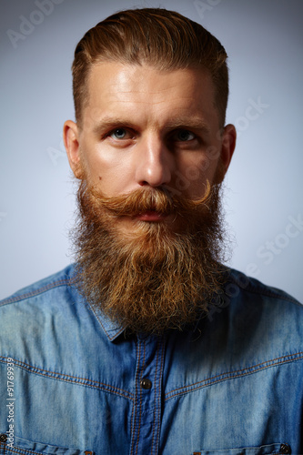 Fotografie, Obraz Bearded man. Handsome man with a beard and twirled mustache.