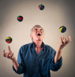 Man juggling with little balls