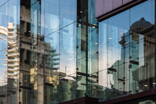 Buildings Reflecting In Office Windows