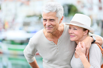 Wall Mural - Senior couple enjoying journey in tourist city