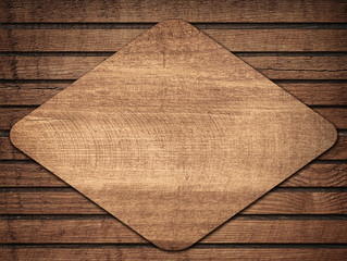 Wall Mural - brown wooden lozenge with shadow on planks wall