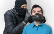 Aggressive masked terrorist or Burglar with balaclava assault an