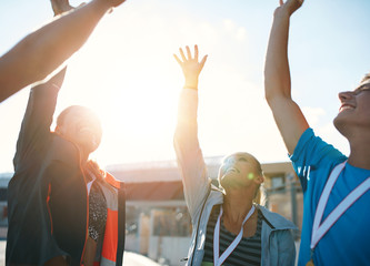 Successful team of athletes cheering victory