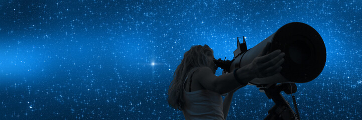 stargazing through a telescope.