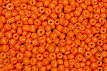 Background Of Scattered Orange Beads Close Up