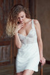 © Iuliia - Indoor portrait of young blond sexy woman in sleepwear