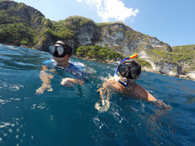 Shoot Of A Young Boy Snorkeling With Father