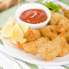 Breaded Butterfly Prawns - Deep Fried Battered Prawns Filled With Garlic Sauce Served With Chili Sauce And Lemon Wedges.