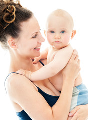 Wall Mural - Mother and baby playing and smiling. Happy family.