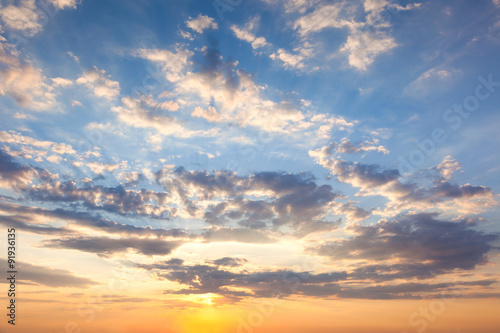 Fototapeta na wymiar Amazing Sundown Sky with Beautiful Clouds and Sunbeams,