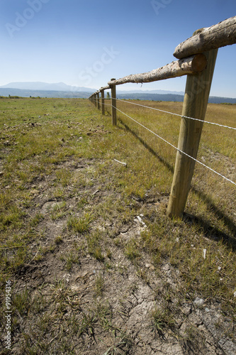 Fotografia, Obraz Receding long fence on ranch, northern Jackson Hole, Wyoming, ve