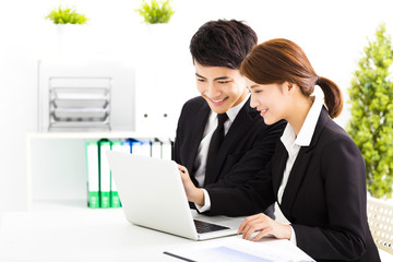 Wall Mural - happy business man and woman working  in office