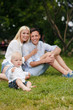 © GTeam - Happy young family spending time together in green nature
