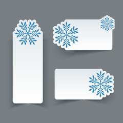 Wall Mural - vector set of blank white paper retro labels with snowflakes.