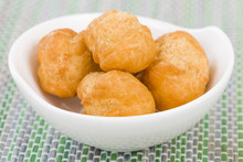 Johnny Cakes - Jamaican Fried Dumplings In A White Bowl.
