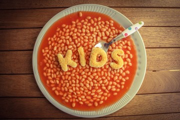 Kids Meal - Baked beans with tomato sauce with breaded letters spelling the word KIDS