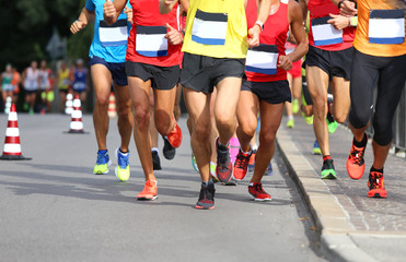 Wall Mural - Runners during the Marathon on the road in town