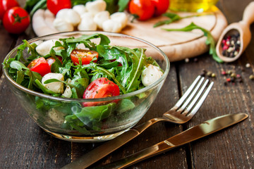 Wall Mural - Caprese salad with mozzarella, tomatoes and arugula