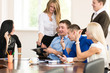 © kanzefar - Cheerful  group of young business people in the office.