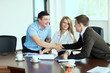© kanzefar - Smiling man at a business meeting shaking hands with each other