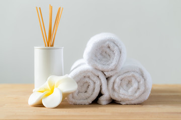 Tropical flowers frangipani with Scented woods and white towel f