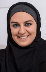 Wall Mural - Smiling arabic woman wearing hijab