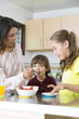 © Herjua - Lovely  Mother and her children having breakfast