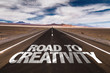 Road to Creativity written on desert road