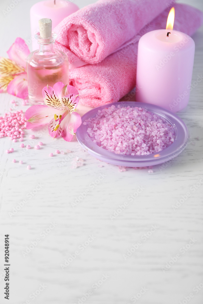 Beautiful composition of spa treatment on white wooden table