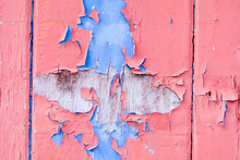 Red And Blue Flaked Paint On Wooden Door
