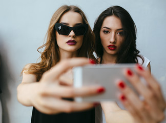 Two girlfriends taking a selfie