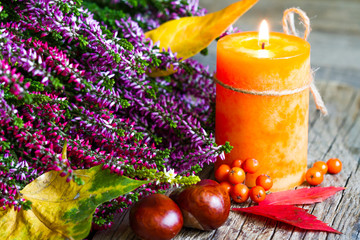 Wall Mural - Autumn still life with candle on old boards