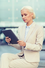 Sticker - businesswoman working with tablet pc outdoors