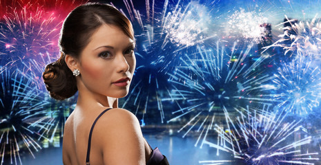 Poster - beautiful woman with diamond earring over firework