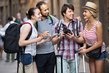 Wall Mural - tourists with map exploring the city destination