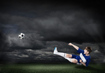 Wall Mural - Young soccer player