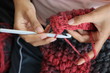 A girl showing how to crochet