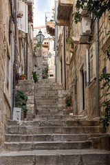  Narrow and empty alley and stairs at the Old Town in Dubrovnik, Croatia.