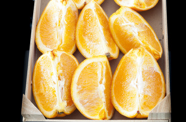 Wall Mural - close-up photo of delicious fresh oranges into wedges