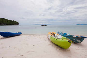 Wall Mural - Colorful kayaks on beach in Thailand