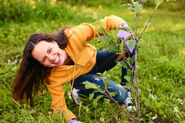 Wall Mural - Young woman in garden.