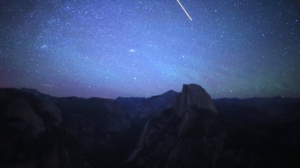 time lapse footage of starry sky and low latitude aurora over half dome in yosemite national park, c