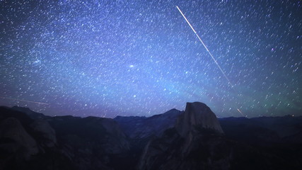 time lapse footage with tilt down motion of star trails over half dome in yosemite national park, ca