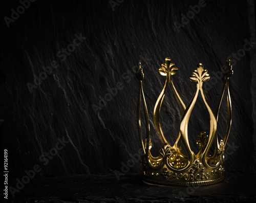 Golden crown with dark background Stock Photo | Adobe Stock