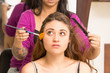 © Fotos 593 - Closeup headshot brunette model facing camera getting makeup