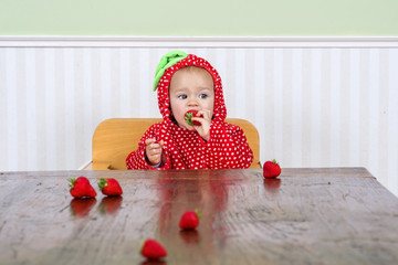 Cute baby in strawberry suit