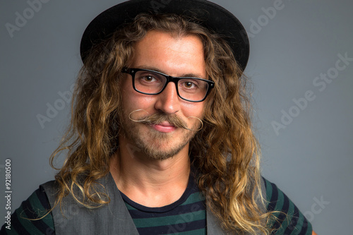 Close Up Headshot Of A Hipster Modern Young Man With Long
