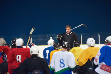 Wall Mural - ice hockey players team meeting with trainer