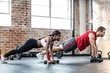 © Wavebreak Media - Fit couple doing dumbbell rows
