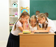 © Africa Studio - Portrait of happy schoolgirls at lesson